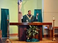 Fr. Josh Swallows celebrating Mass.