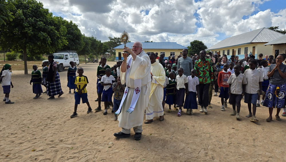 Eucharistic procession with students and villagers in Tanzania.