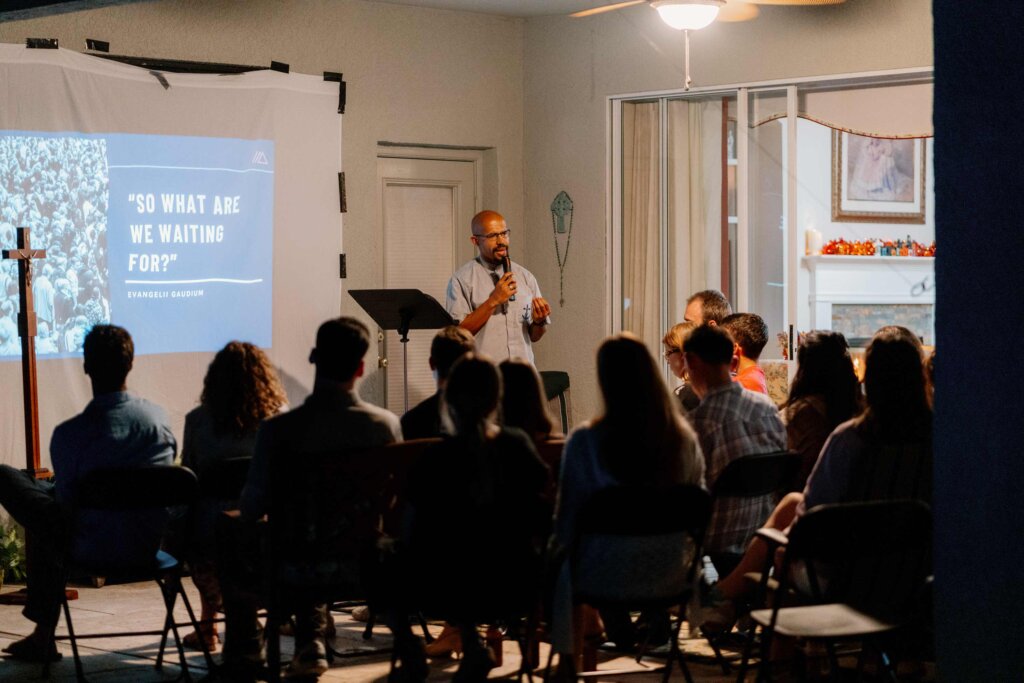 Brother speaking to students at a ministry gathering